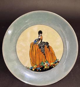 Noritake Art Deco portrait lusterware plate with a scene of a lady in a gown, 7¾ inches in diameter. Estimate: $100-$200