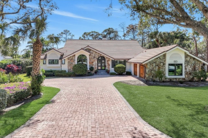 This fully renovated home blends modern luxury with resort-style living in the renowned Bonita Bay Clu