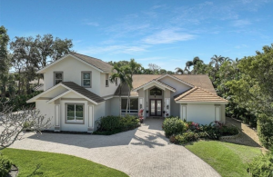 This 3,891-square-foot home sits on a 0.58-acre lakefront homesite and includes four bedrooms and three and a half baths. Built in 2016, the open-concept layout features 12-foot tray ceilings and crown molding throughout.