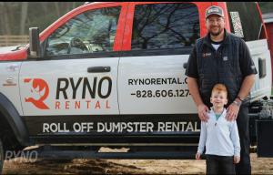 Ryno Rental truck with Ryan Maxwell and his son standing in front of the truck.