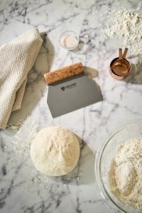 STEELPORT Bench Scraper in use with dough.