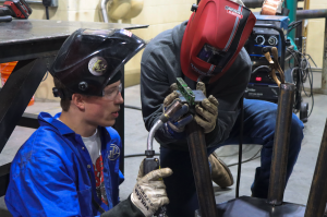 Students working on a team welding project