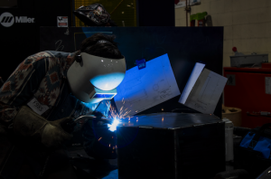 Student Welding in the Welding Wars 2025 competition