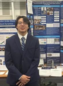 Maximillian Kopp stands in front of his science fair display showcasing a printed sensor system for spacecraft safety. His project earned the U.S. Navy Environmental Science Award.