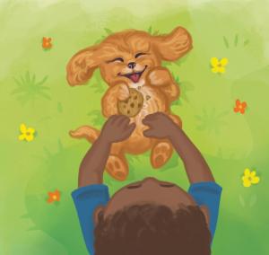 Young boy petting a smiling dog holding a cookie.