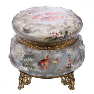 Lovely dresser box with the Wave Crest mark, in sea foam mold and boasting an extremely rare goldfish décor. The box, with gilt metal feet, comes with a key. Estimate: $4,000-$7,000