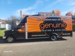 Branded Genuine Heating & Cooling van parked on a residential street