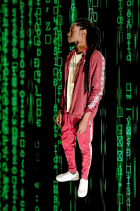 "Rast Dias in a striking red tracksuit against a black and green Matrix-style hacker backdrop, blending style with a high-tech, cyber-inspired aesthetic."