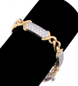 Tiffany & Company diamond bracelet set in 18k gold and platinum, alive with 110 round brilliant cut diamonds weighing approximately 3.75 total carats. Estimate: $9,000-$18,000