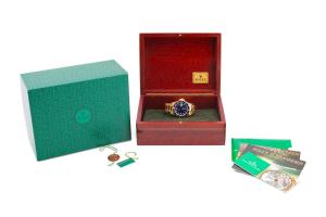 Rolex Oyster Perpetual Submariner date wristwatch in 18k yellow gold with a blue dial, white markers, date window, synthetic sapphire crystal and oyster bracelet. Estimate: $26,000-$29,000