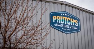 Exterior signage of Prutch’s Garage Door & More at the Colorado Springs location, opened in Fall 2024. Family-owned garage door service in Colorado since 1989.