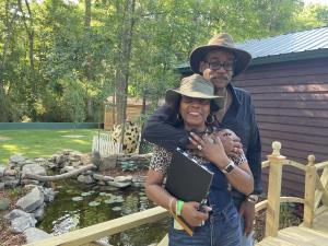 Sweet Valley Ranch founders Fred and Anita Surgeon at the farm’s goldfish pond, where adventure meets heart and hospitality.