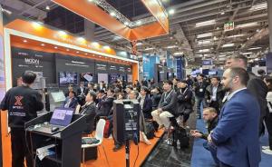 Steady visitor traffic at INTERX’s booth showcasing diverse AX solutions.