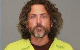 Jonathan Boyd’s mugshot during years of addiction and incarceration.