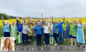 A female choir standing in front of a yellow field on a rainy day. Inserted is a photo of Project Lead, Vibe Bregendahl a Caucasian women mid forties.