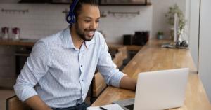 Man in headphones on laptop