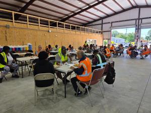 Durham School Services team members gathered together to enjoy lunch at the bus yard facility grand opening event