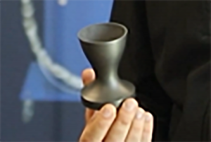 A rocket nozzle manufactured with Titomic Kinetic Fusion™ showcasing rotational build capability with tantalum for high-temperature applications.