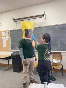 Sidney training a TXCC member with proper safety equipment