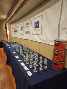 Awards TrophyWorld's custom crystal awards on a table for the Rotary Club of Weston Hills Golf Classic.