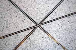double zinc divider strips in epoxy terrazzo design