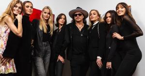 Marko Stout poses with his models during solo exhibition at Kate Oh Gallery 2024
