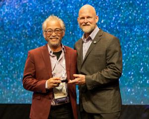 Photo of Lyndon Azcuna, Executive Director of LifePlan, accepting Waypoint Award from James Whitford, Co-founder and CEO of True Charity
