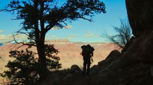 Actor John Charles Meyer silhouetted against the Grand Canyon in the feature film "Granite Rapids Moon"