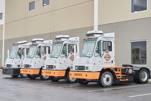 Orange EV yard trucks