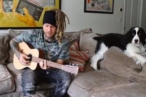 Iakopo playing his guitar