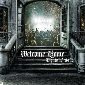 CD cover showing steps and wide open doors with a concert and audience inside the building with "Welcome Home" written on the steps