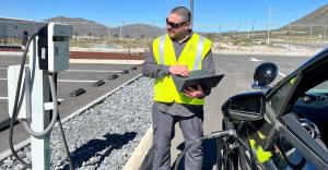 Regular InService maintenance visits help customers extend the life of their charging equipment. This is a photo showing an InCharge technician performing service outdoors at a Level 2 (AC) charger.
