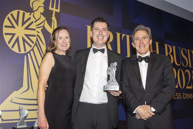 Managers from thebigword being presented their award by Rob Brydon