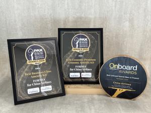 China Airlines’ award plaques for Best Business Class Amenity Kit, Best Premium Economy Amenity Kit, and Best Onboard Special Meal or Product, presented by PAX International and Onboard Hospitality Awards 2025.