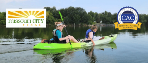 Two women paddle a bright green kayak on a peaceful lake, surrounded by lush greenery, with logos for Missouri City and Certified Autism Center.