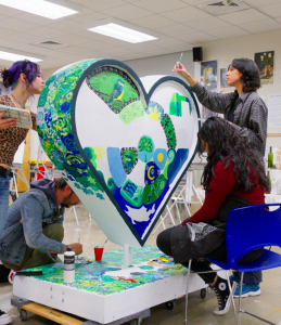 College of Western Idaho Art Club students decorating their Hearts Across the Valley hear.