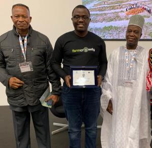 Farmcrowdy CEO, Onyeka Akumah displaying the UNIDO Disruptive Innovation Award flanked by the Nigerian Ambassador to the Vatican, Ambassador GG Umo and the Nigeria