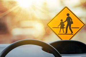 Image of School Zone Crossing Sign from inside a car.