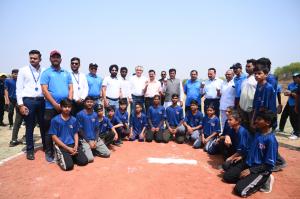 Team DDA in blue DDA jerseys pose with DDA leadership and elite guests at the BallPark Ground Breaking Ceremony
