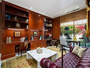 An interior area of a beautiful home featuring several artworks with natural woody and earthy color themes.