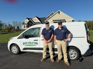 Owner Steve Dalessandro  stands with Justin Smith in front of their van ready to start their Deer Solution business journey.