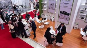 "Visitors interacting at the Agrimax Group exhibition stand at Caspian Agro 2025 in Azerbaijan."