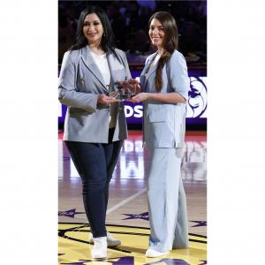 Amy Nadimi receives the Woman of Promise award on court at Crypto.com Arena during halftime of a Los Angeles Lakers game