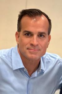 A headshot photo of Brian Vogel, VP of Commercial Operations