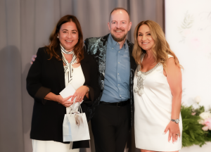 Opportunity Item winner Amanda Manahan, Bill Peters – Lugano Director of Client Development, and Laura Collins – Miracles for Kids Sr