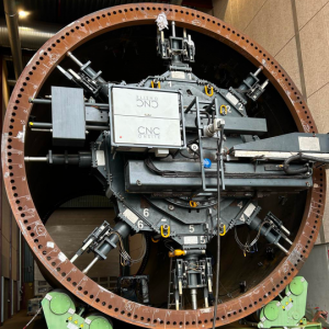The tower flange is seen with many handwritten notes denoting size and dimensions. Goliath, CNC Onsite's precision machine, has been mounted and is ready to start the process