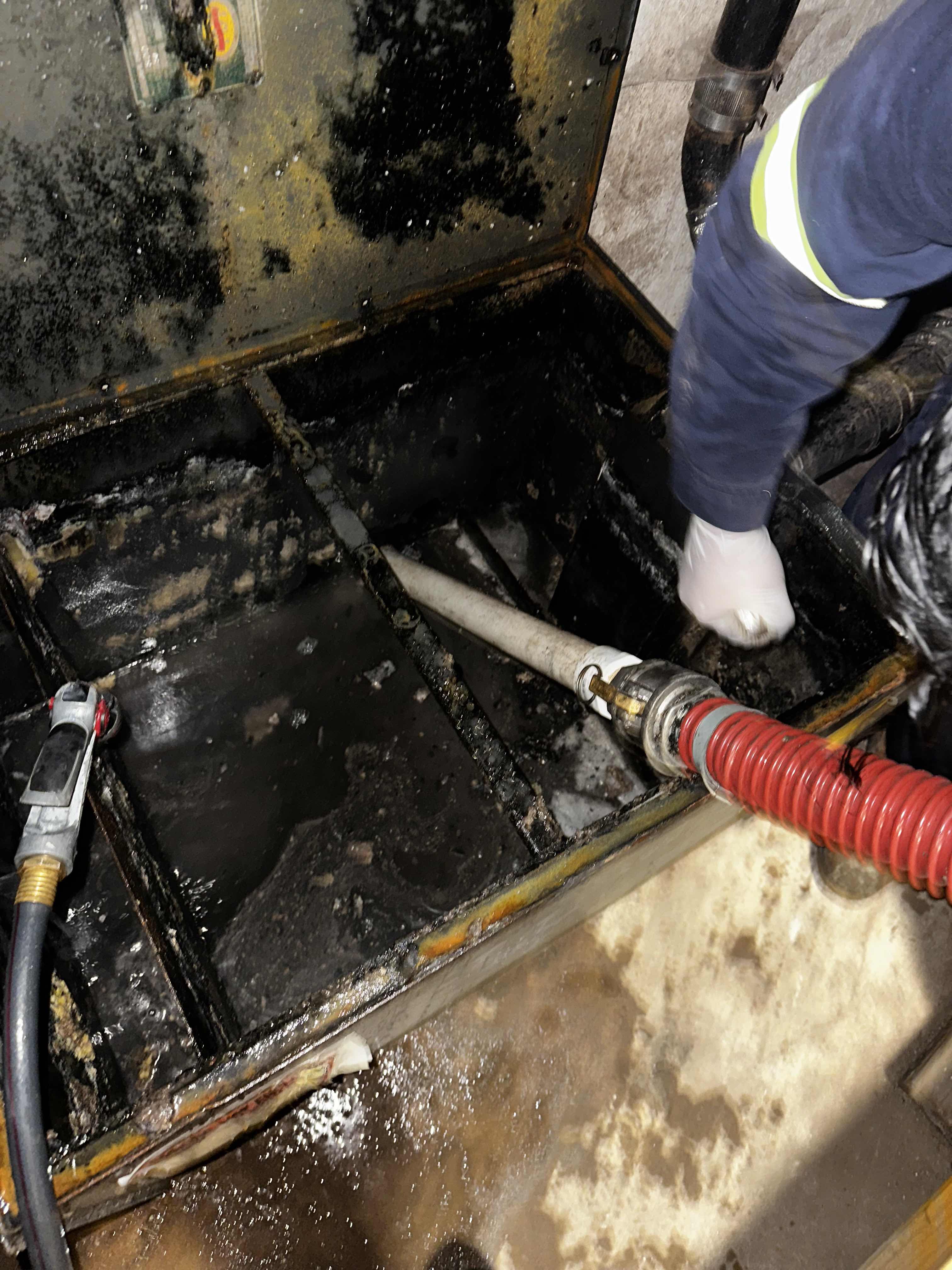 Green Oil Recycling Suctioning the Grease out of a Grease Trap at The World Trade Center