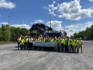 A group picture of the students gathering in front of the Paducah, KY Fire Department Truck and the CSX Training Car
