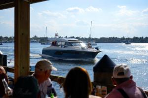 Eating burgers and watching a boat cruise by Le Tub's dock