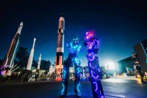 Neon Stilt Walkers at Kennedy Under the Stars